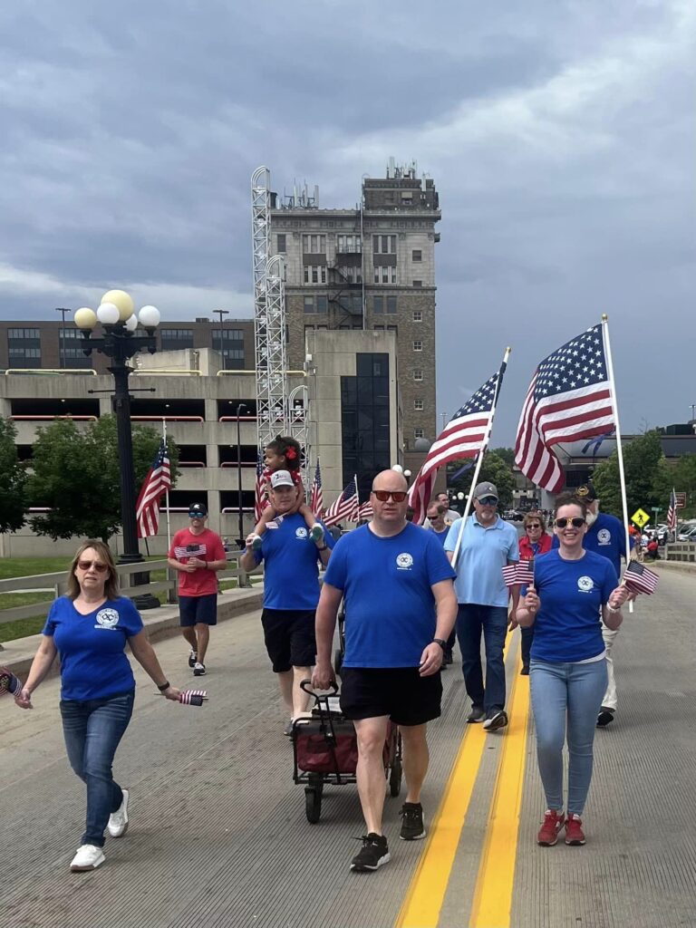 1,000 flags are distributed during the Memorial Day Parade